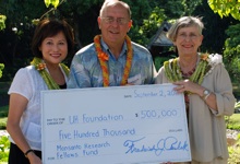 Sylvia Yuen, Fred Perlak, and Virginia Hinshaw with Monsanto check